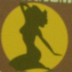 A silhouette of a provocatively posed female figure.